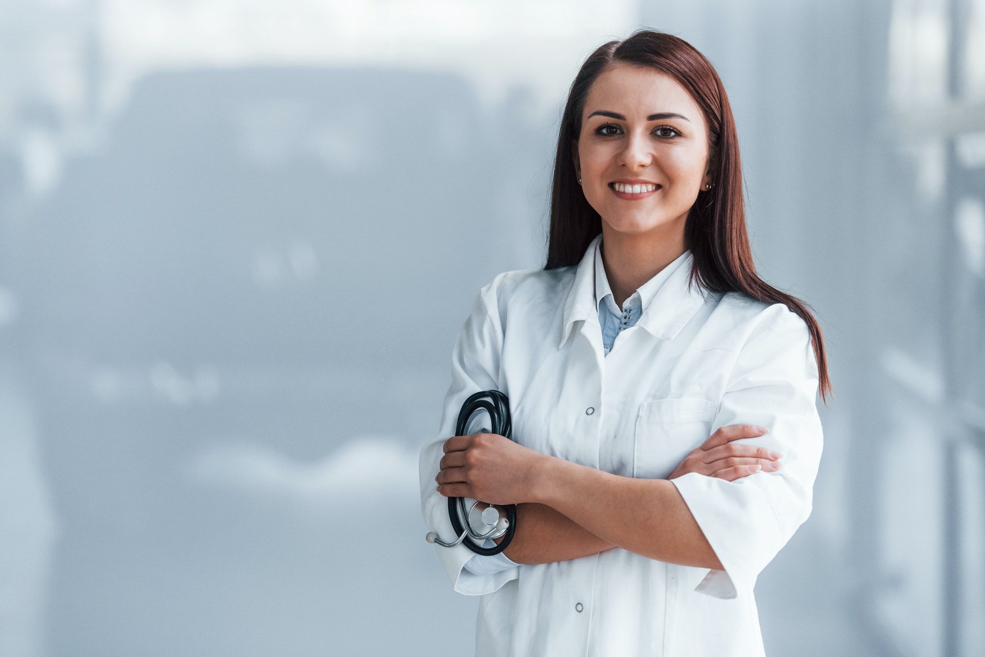 Young nurse indoors in modern clinic. Conception of healthcare