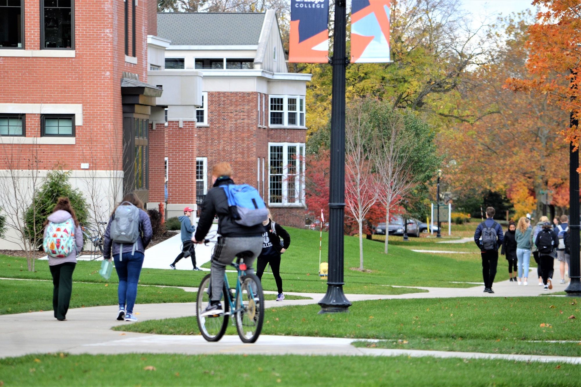 College students between class on campus in the fall!